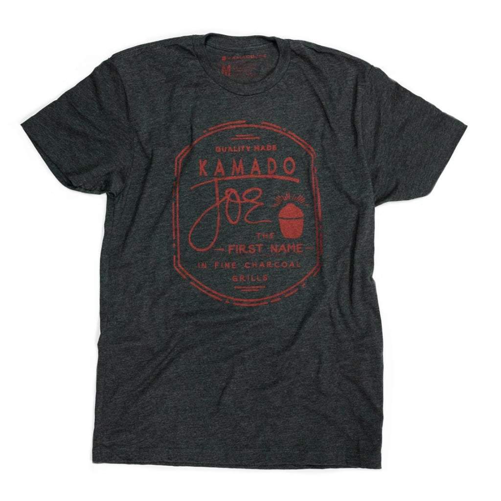 Dark gray t-shirt with a red graphic featuring the text "Quality made Kamado Joe - The first name in fine charcoal grills"