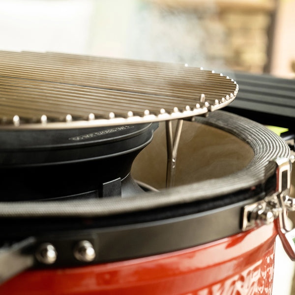 SloRoller with stainless steel grate attachment in Kamado Joe Grill