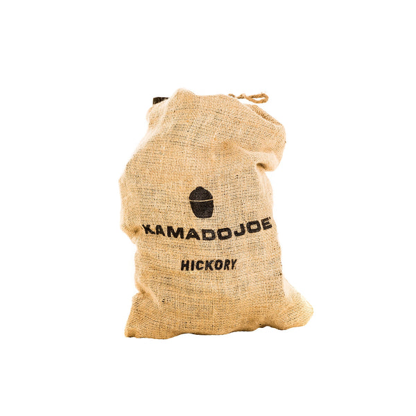 Burlap bag, tied closed at the top, with the Kamado Joe logo and the text "Kamado Joe Hickry" stamped on it.