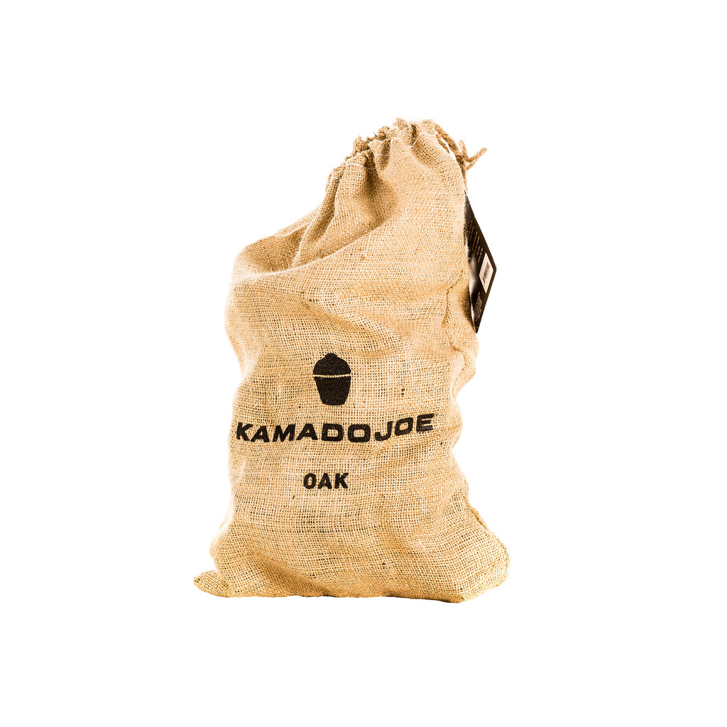 Burlap bag, tied closed at the top, with the Kamado Joe logo and the text "Kamado Joe Oak" stamped on it.