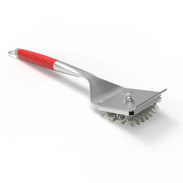 Stainless steel Kamado Joe bristle brush with built-in scraper against a white background
