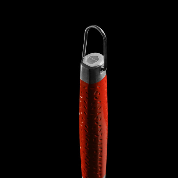 Closeup of the end of the brush handle showing the dimpled red handle, the convenient hanging hook, and the Kamado Joe grill logo etched in the end of the handle