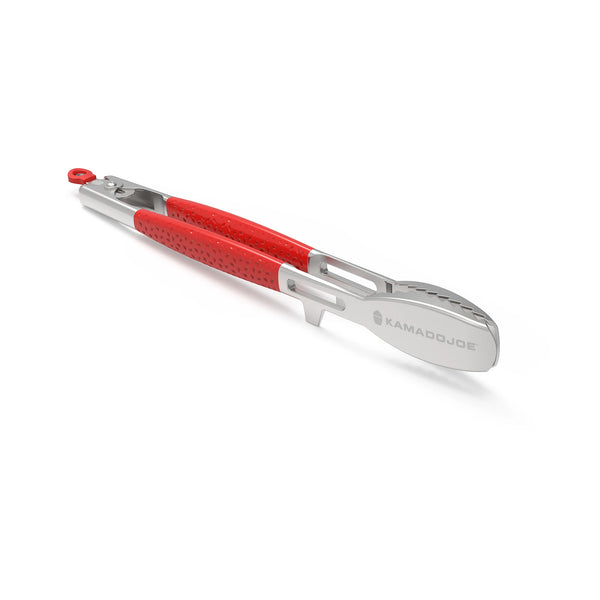Stainless steel tongs with dimpled red handles sitting on the edge notch sop the head is raised from the surface.