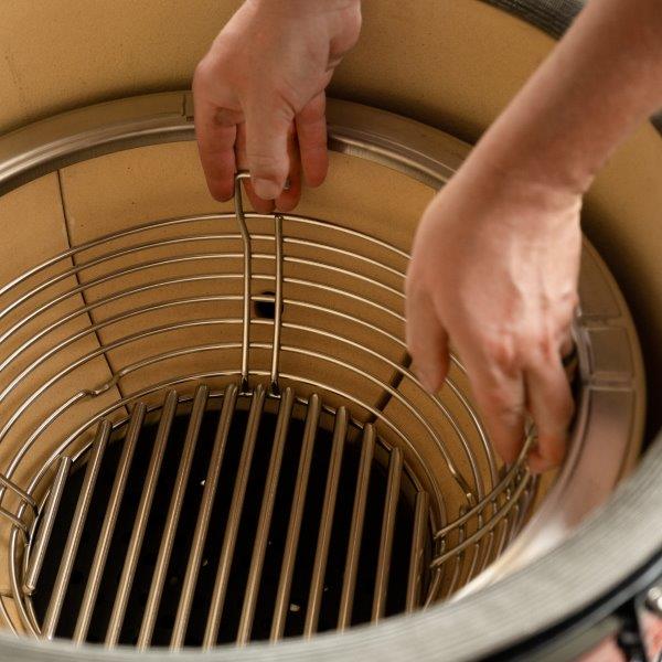 Inserting charcoal basket into the firebox