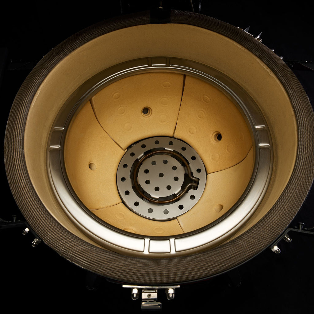 Automatic Fire Starter system sits at the bottom of the multi-piece ceramic firebox