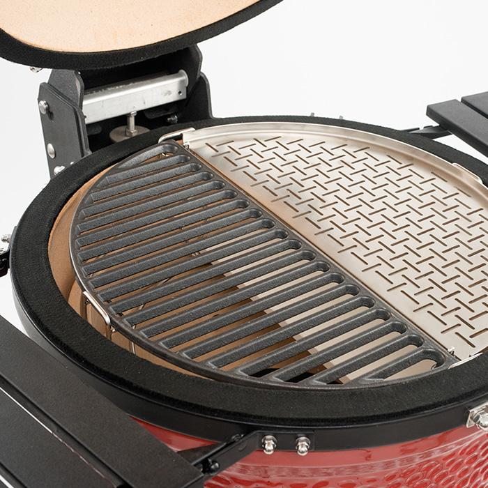 The cast iron half grate shares grill space with a stainless steel half grate