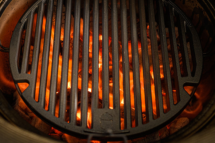 The Kamado Joe® Sear Plate heating up on a Kamado Joe grill