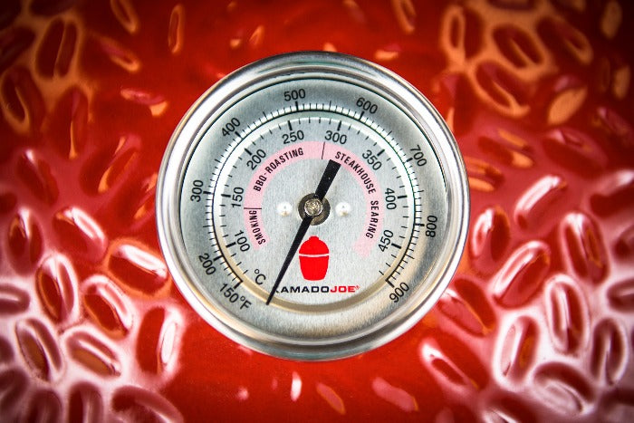 Thermometer inserted into grill dome